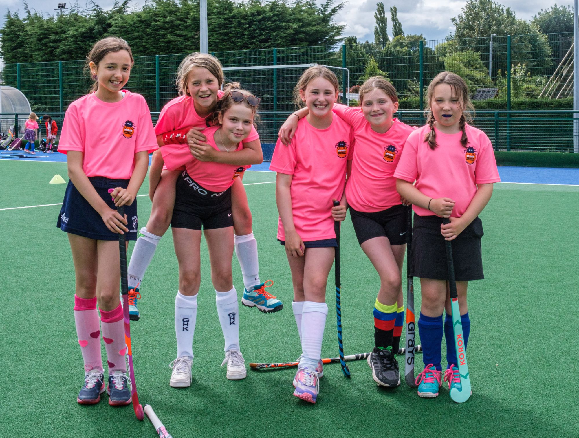 Young players with hockey sticks at Spider Hockey summer camp, Milngavie